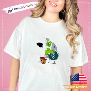 Santa Grinch On Miami Dolphins Toilet And New Orleans Saints Helmet Christmas T Shirt