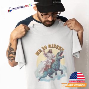 he has rizzen Jesus Riding A Dinosaur Funny Meme T Shirt