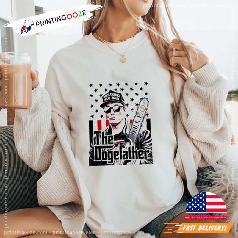 Elon Musk Doge The Dogefather Chainsaw Graphic T-shirt Elon Musk Doge The Dogefather Chainsaw Graphic T-shirt