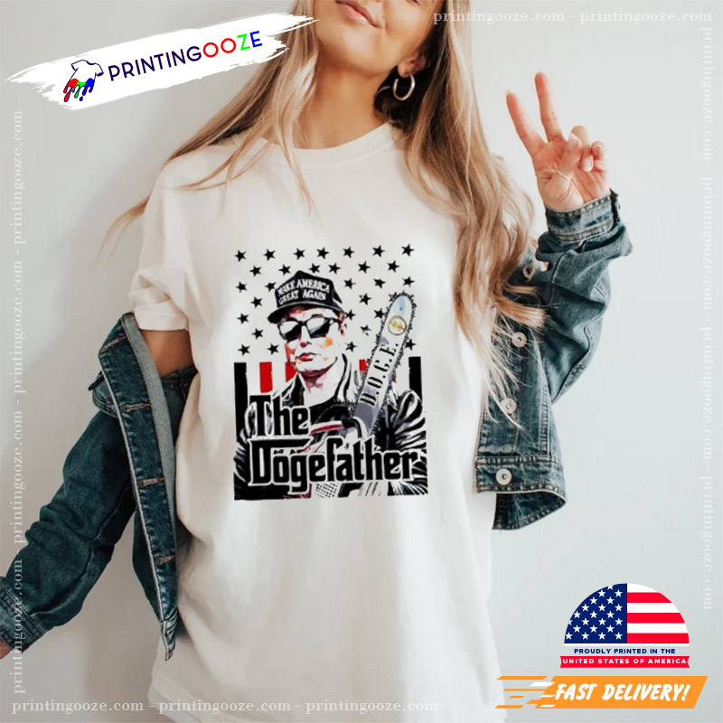 Elon Musk Doge The Dogefather Chainsaw Graphic T-shirt Elon Musk Doge The Dogefather Chainsaw Graphic T-shirt